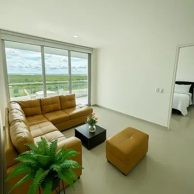 a living room with a couch and a table at Comodo Apartamento en morros epic! in Cartagena de Indias