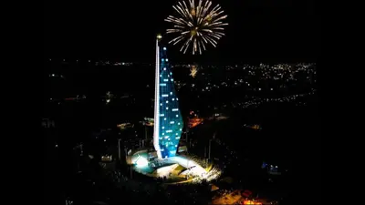 a tower with fireworks in the sky at night at Tranquilo Apartamento Central Cerca a la Playa Puerto Colombia in Puerto Colombia