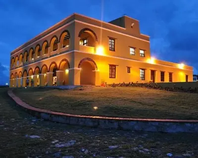 a large building with lights on the side of it at Hermoso Apartamento Cerca a la Playa Puerto Colombia in Puerto Colombia