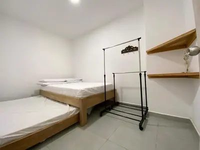 a room with two bunk beds and a shelf at Apto 1er piso frente a la playa y con piscina in San Bernardo del Viento