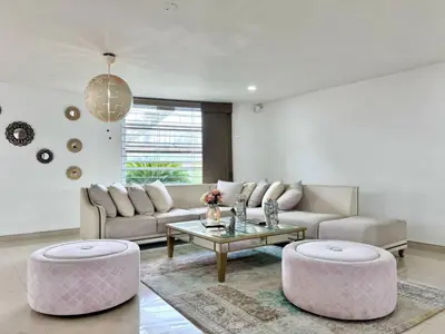 a living room with a couch and a table at HELENE HOUSE in Sincelejo