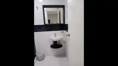 a white bathroom with a sink and a mirror at Bm-8 room near the sea with air conditioning and WIFI in Cartagena de Indias