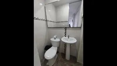 a bathroom with a toilet and a sink at Bm-17 Charming Cartagena Lodge with Shared Pool Terrace in Cartagena de Indias