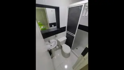 a bathroom with a toilet and a sink and a mirror at Bm-3 room near the sea with air conditioning and WIFI in Cartagena de Indias