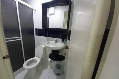 a bathroom with a toilet and a sink and a mirror at Bm-5 room near the sea with air conditioning and WIFI in Cartagena de Indias