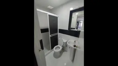 a bathroom with a toilet and a sink and a mirror at Bm-12 room near the sea with air conditioning and WIFI in Cartagena de Indias