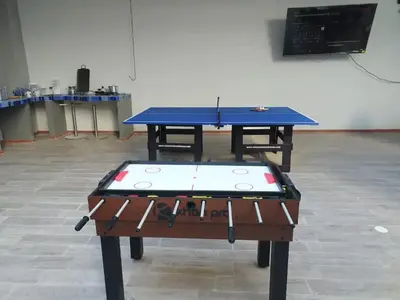 a ping pong table in a room with at Bm-12 room near the sea with air conditioning and WIFI in Cartagena de Indias