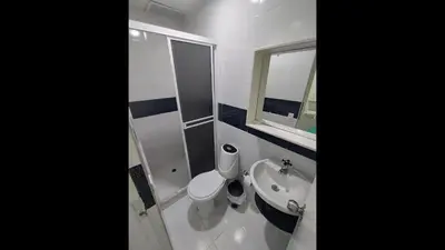 a bathroom with a toilet and a sink and a mirror at Bm-13 room near the sea with air conditioning and WIFI in Cartagena de Indias