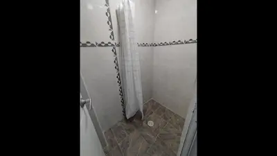 a bathroom with a shower with a glass door at Bm-7 room near the sea with air conditioning and WIFI in Cartagena de Indias