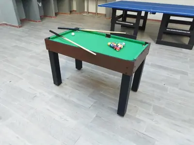 a green pool table with balls and cues on it at Bm-7 room near the sea with air conditioning and WIFI in Cartagena de Indias