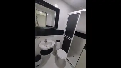 a bathroom with a sink and a toilet and a mirror at Bm-14G Charming Cartagena Lodge with Shared Pool and Private Terrace in Cartagena de Indias